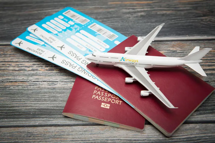 Image depicting travel documents and an aircraft model, symbolizing charter flight planning.